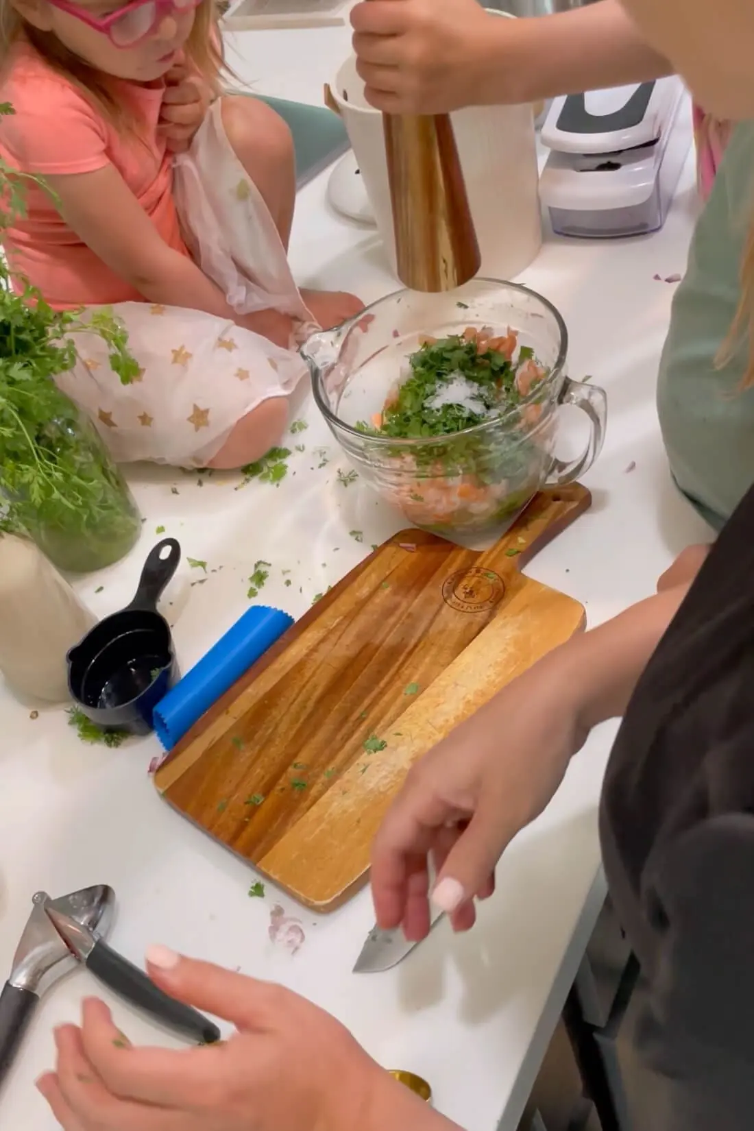 Adding salt and pepper to my ceviche recipe.